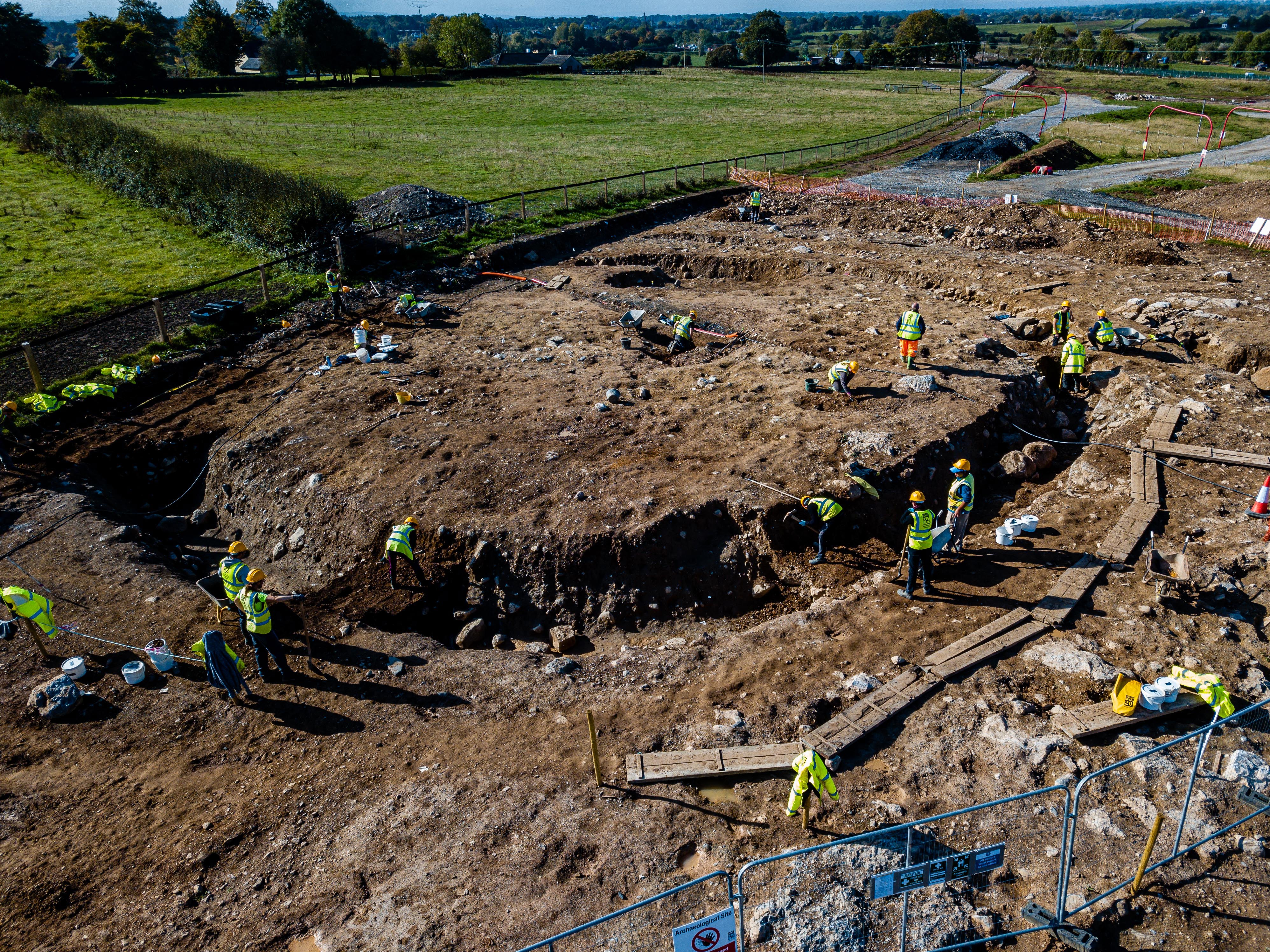 Illustration 5: The archaeological team excavating the enclosure ditch, where the brooch-pin was recovered (looking southwest) (Photo: John Channing, AMS).